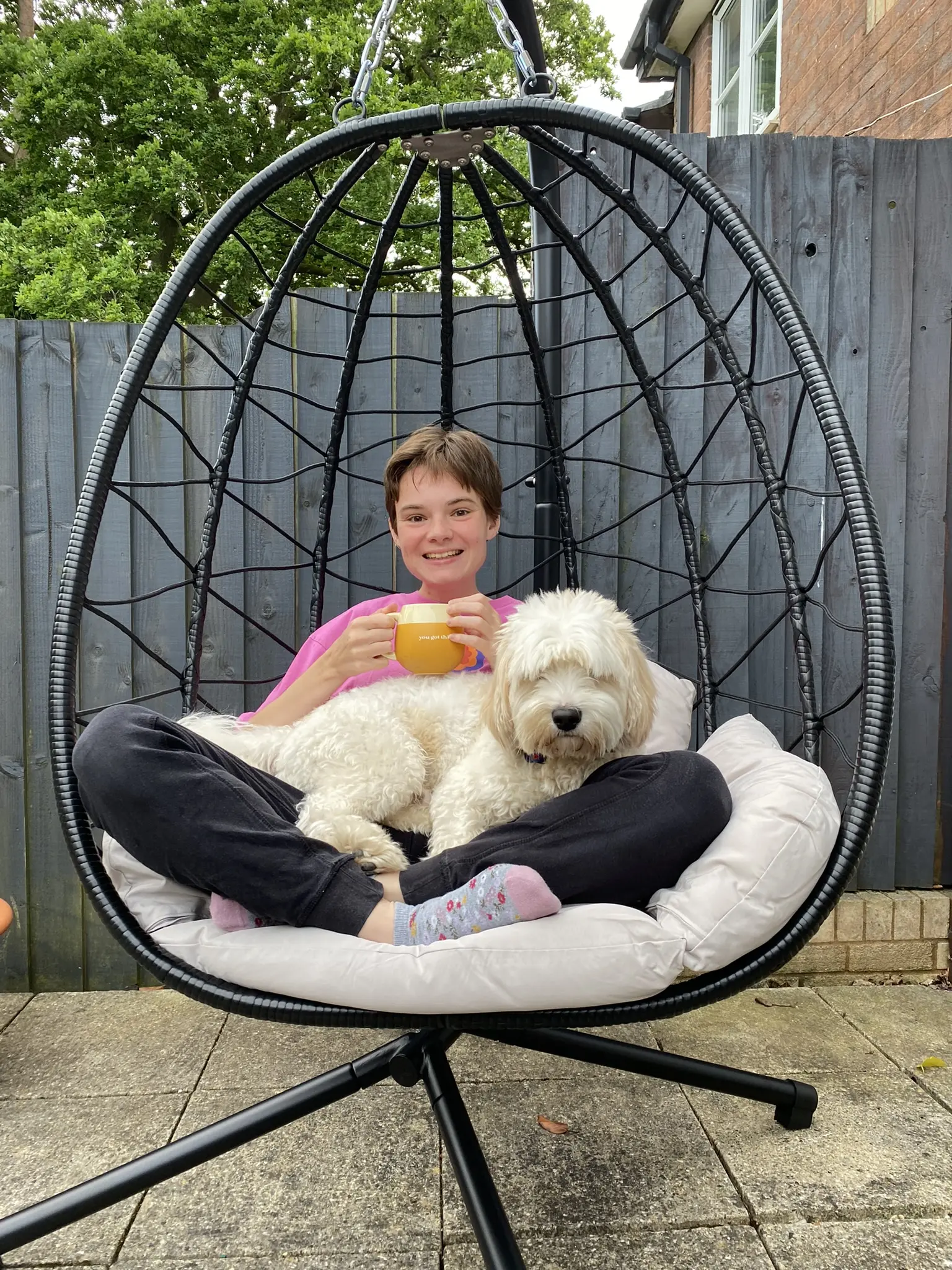 Abi and Teddy on the egg chair